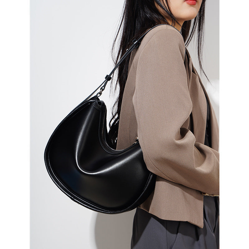 crescent-shaped leather shoulder bag with top zip – OLIVEA