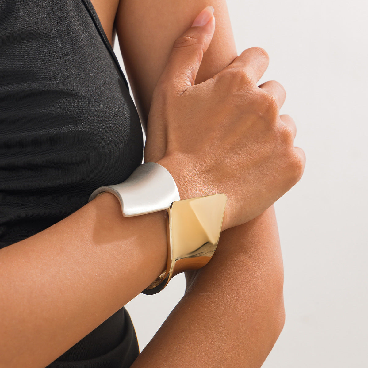 Two-tone wide cuff bracelet with sculptural twist - Nesdu
