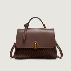 Pleated leather handbag with metal clasp - Lero