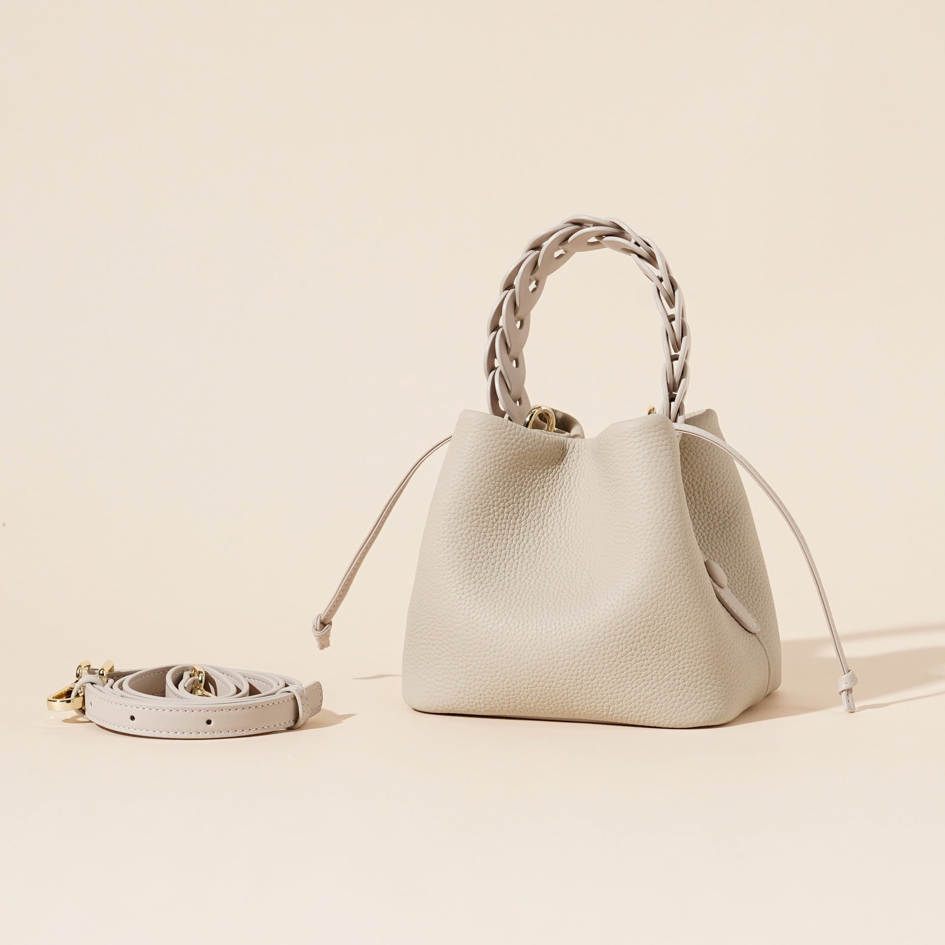 ivory pebbled leather bucket bag with braided top handle – CALISTA