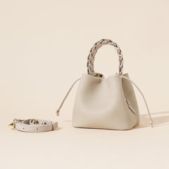 ivory pebbled leather bucket bag with braided top handle – CALISTA