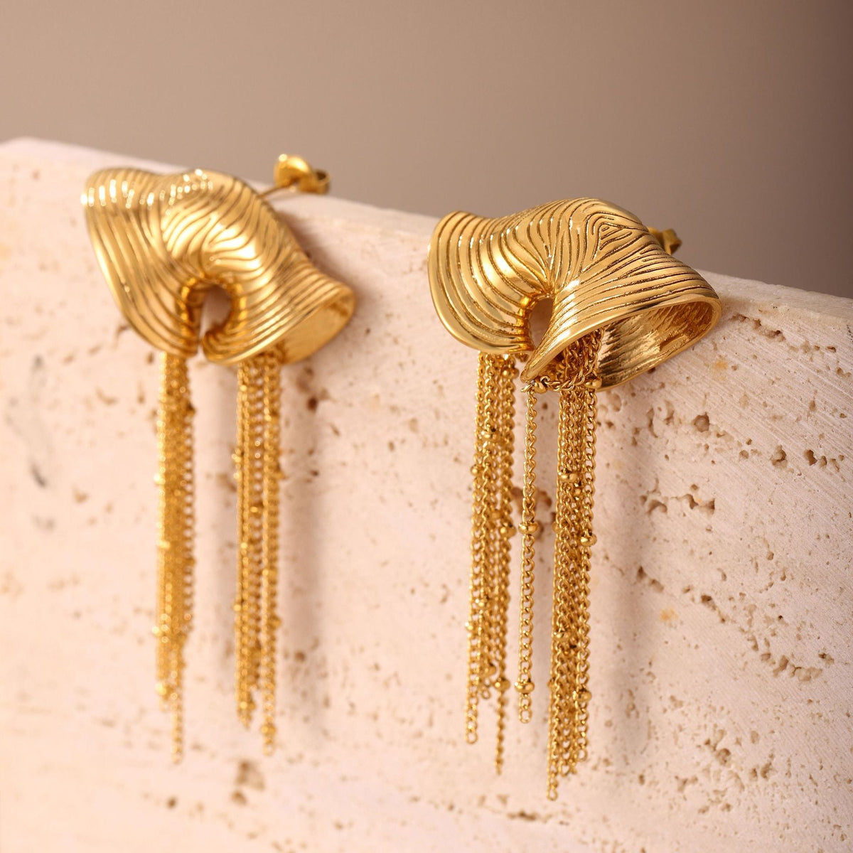 sculpted gold fan earrings with cascading chain tassels – VALINA