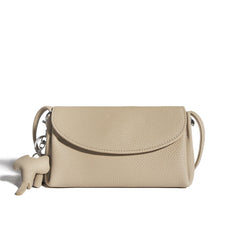 textured flap crossbody bag with elephant charm - NOMA