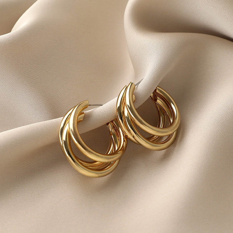 Triple hoop drop earrings in polished gold-tone finish - Arma