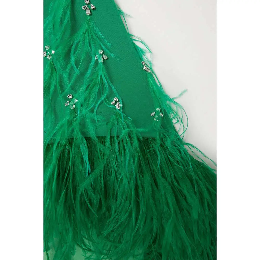 feather-embellished cape gown in emerald – Svadhi