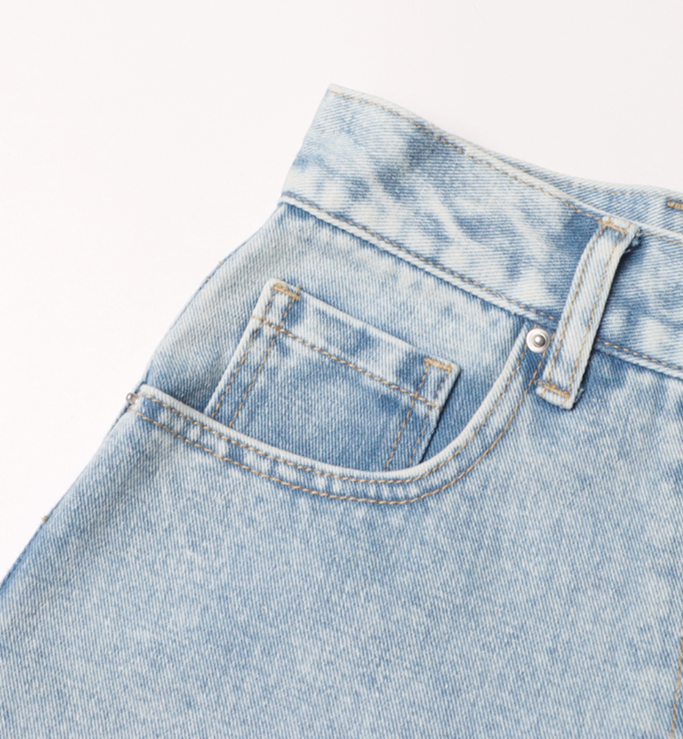 high-waist tapered jeans with exaggerated side flaps - Eireen