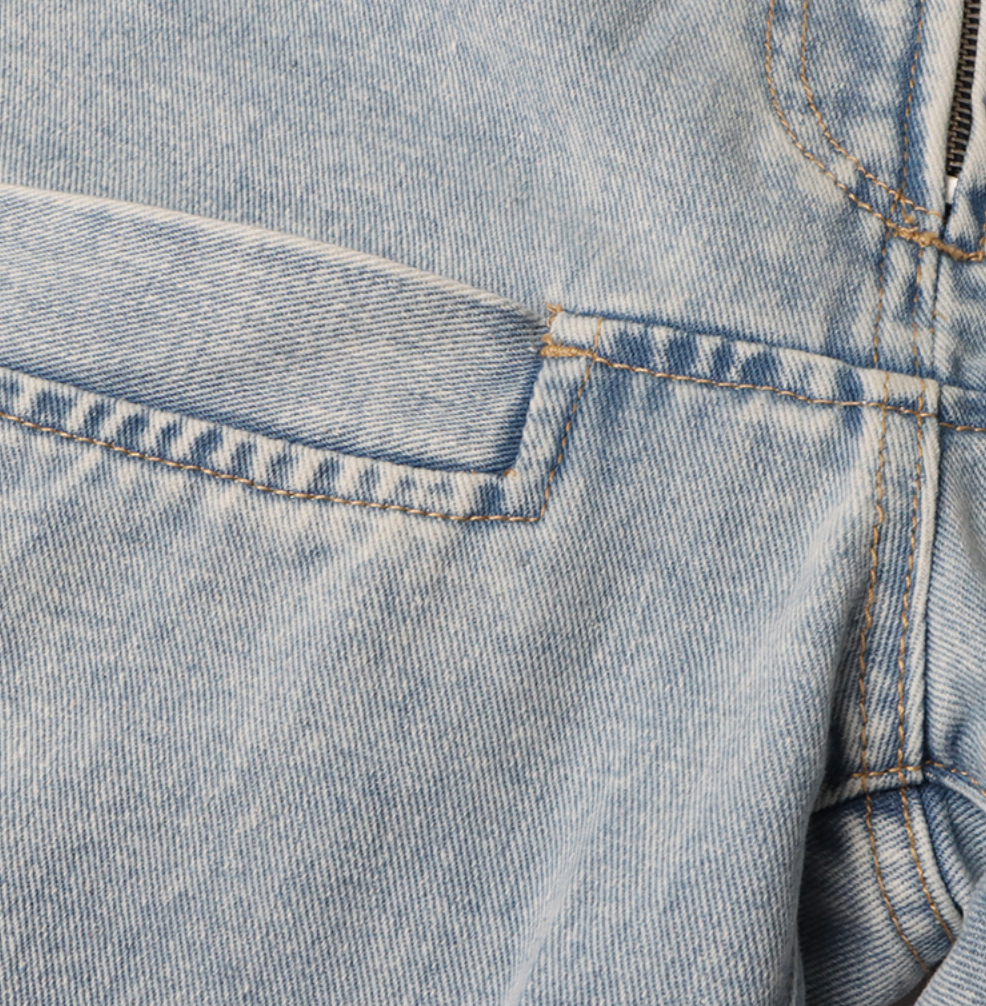 high-waist tapered jeans with exaggerated side flaps - Eireen