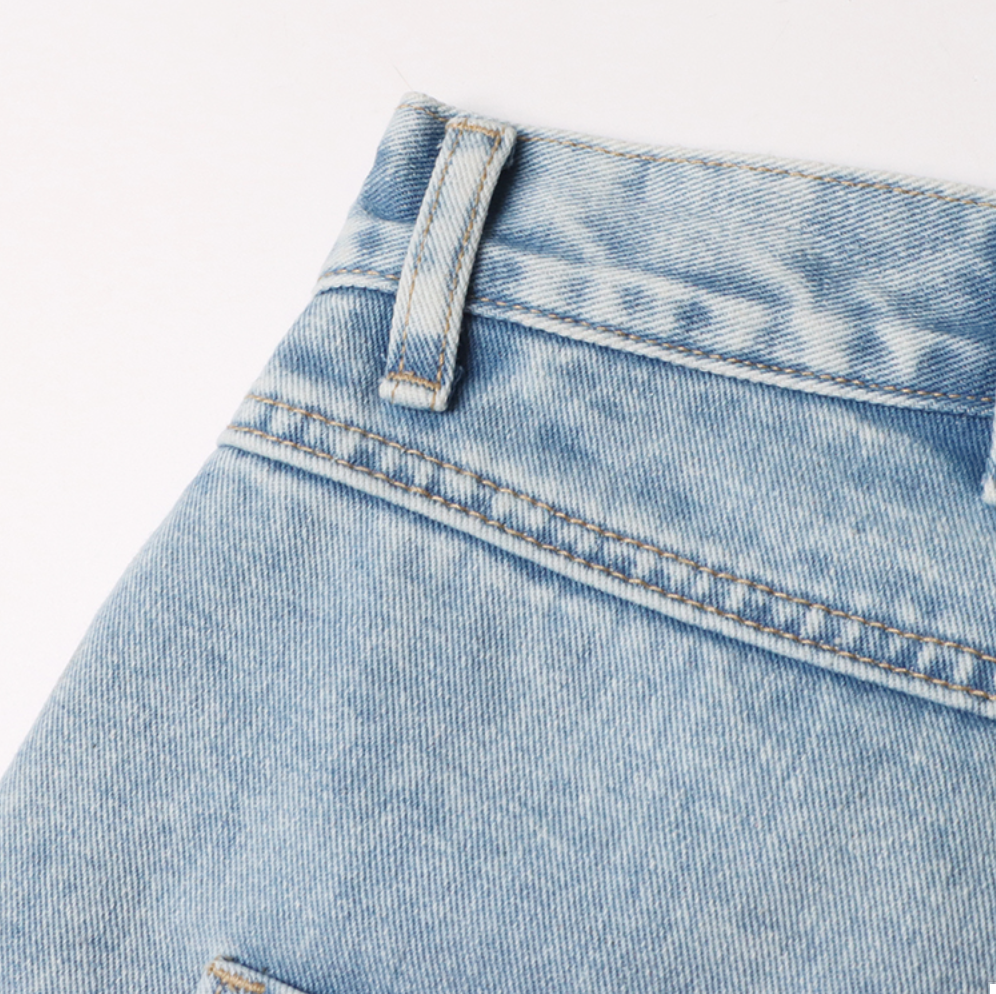 high-waist tapered jeans with exaggerated side flaps - Eireen