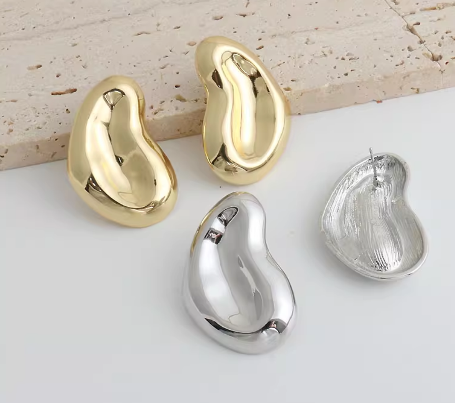 Sculptural folded earrings with abstract silhouette - Rolmi