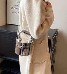 metallic dome clutch bag with sculptural handle – NOVQA