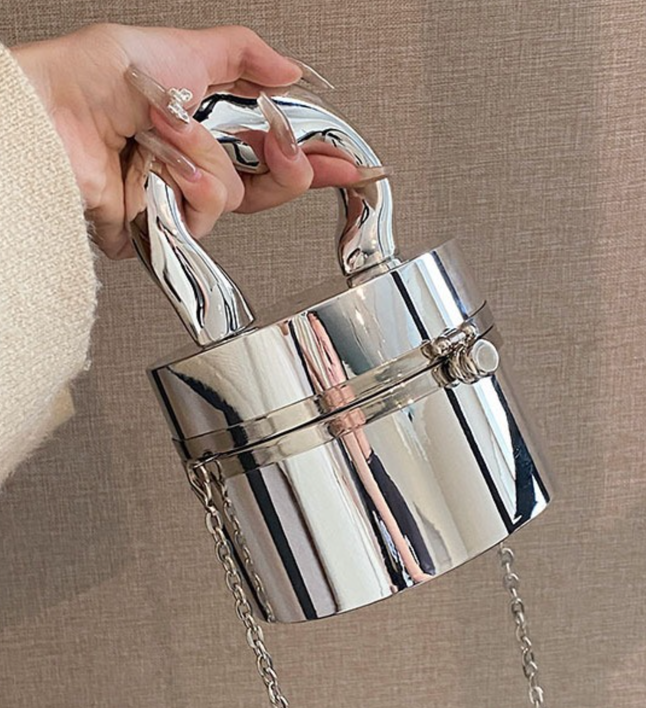 metallic dome clutch bag with sculptural handle – NOVQA