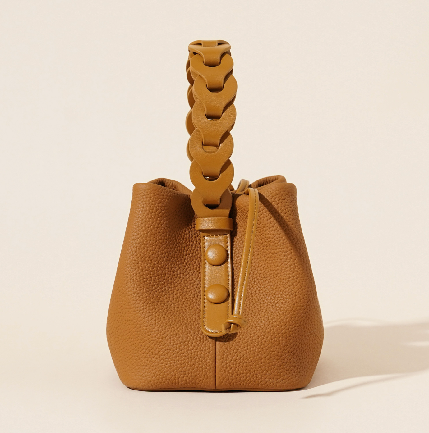 ivory pebbled leather bucket bag with braided top handle – CALISTA