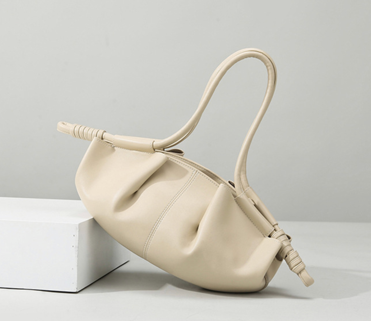 ruched crescent bag with knotted handles – NYRA