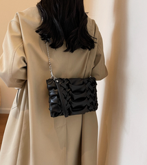 woven clutch with sculpted leather detail – FAYE
