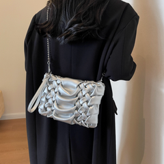woven clutch with sculpted leather detail – FAYE