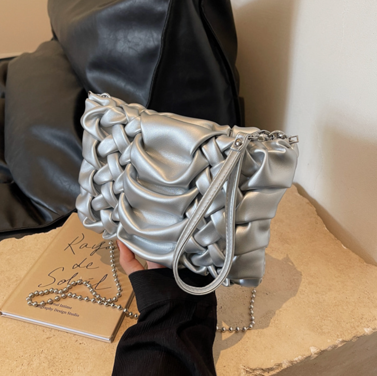 woven clutch with sculpted leather detail – FAYE