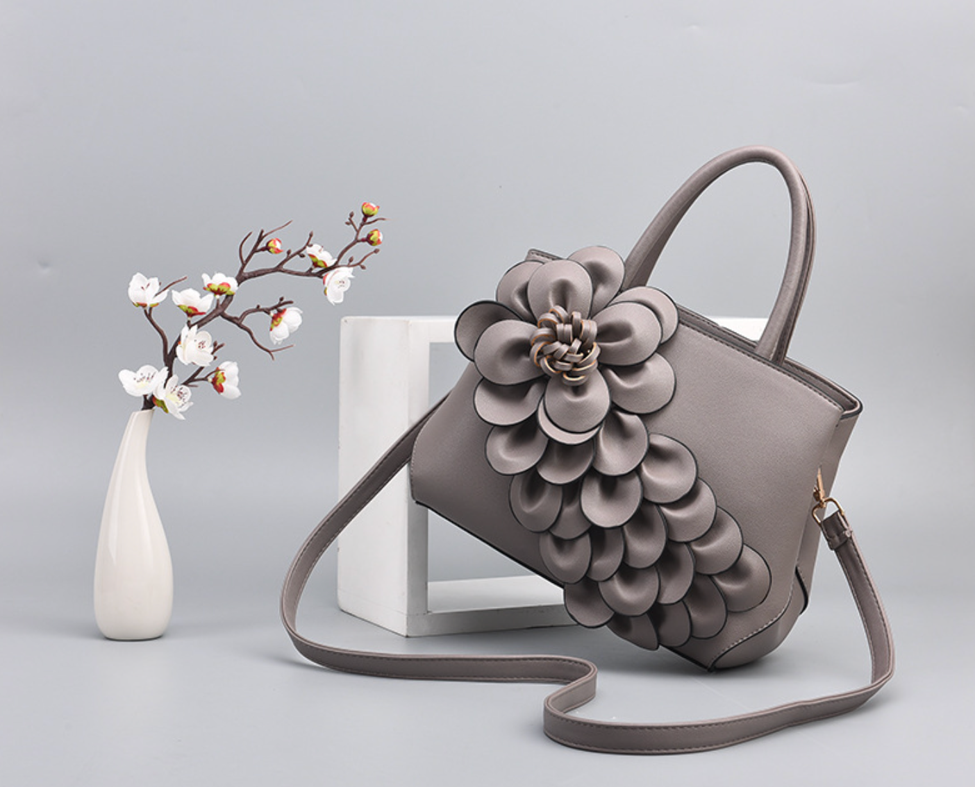 top-handle bag with 3D floral appliqué – AMARA