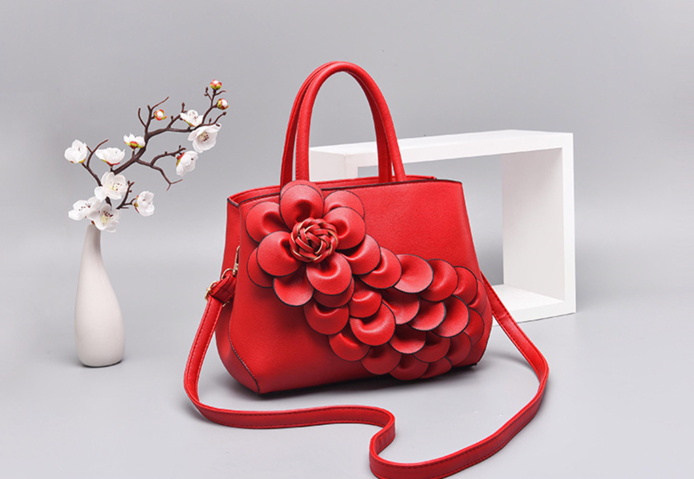 top-handle bag with 3D floral appliqué – AMARA
