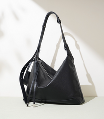 slouchy leather shoulder bag with minimalist charm – NOVIR