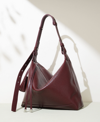 slouchy leather shoulder bag with minimalist charm – NOVIR
