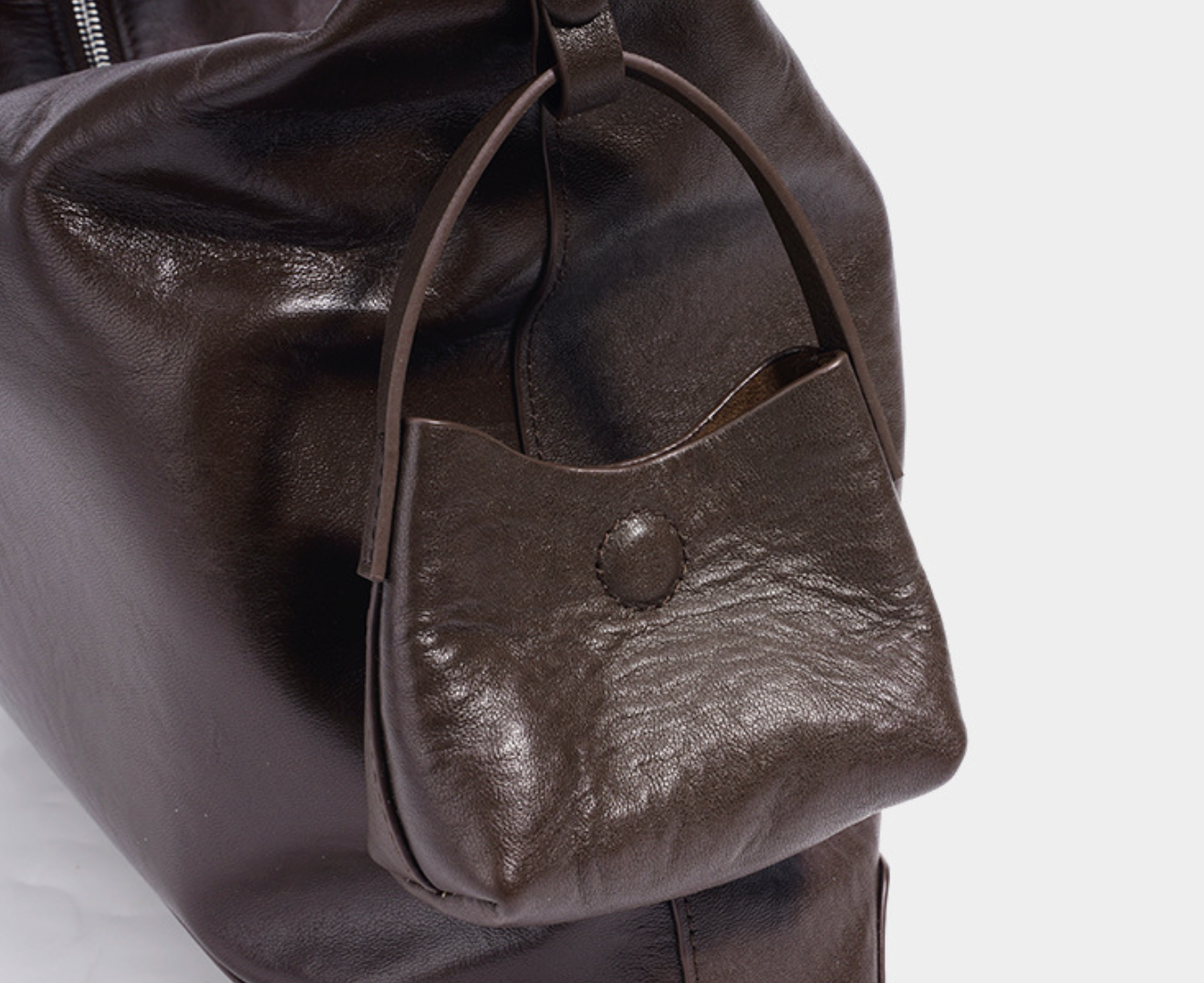 slouchy leather shoulder bag with minimalist charm – NOVIR