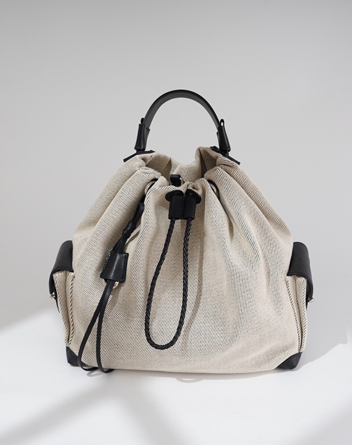 striped canvas drawstring bucket bag with leather trims – NOIIR