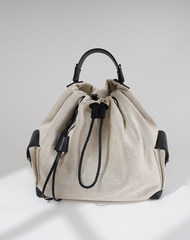 striped canvas drawstring bucket bag with leather trims – NOIIR