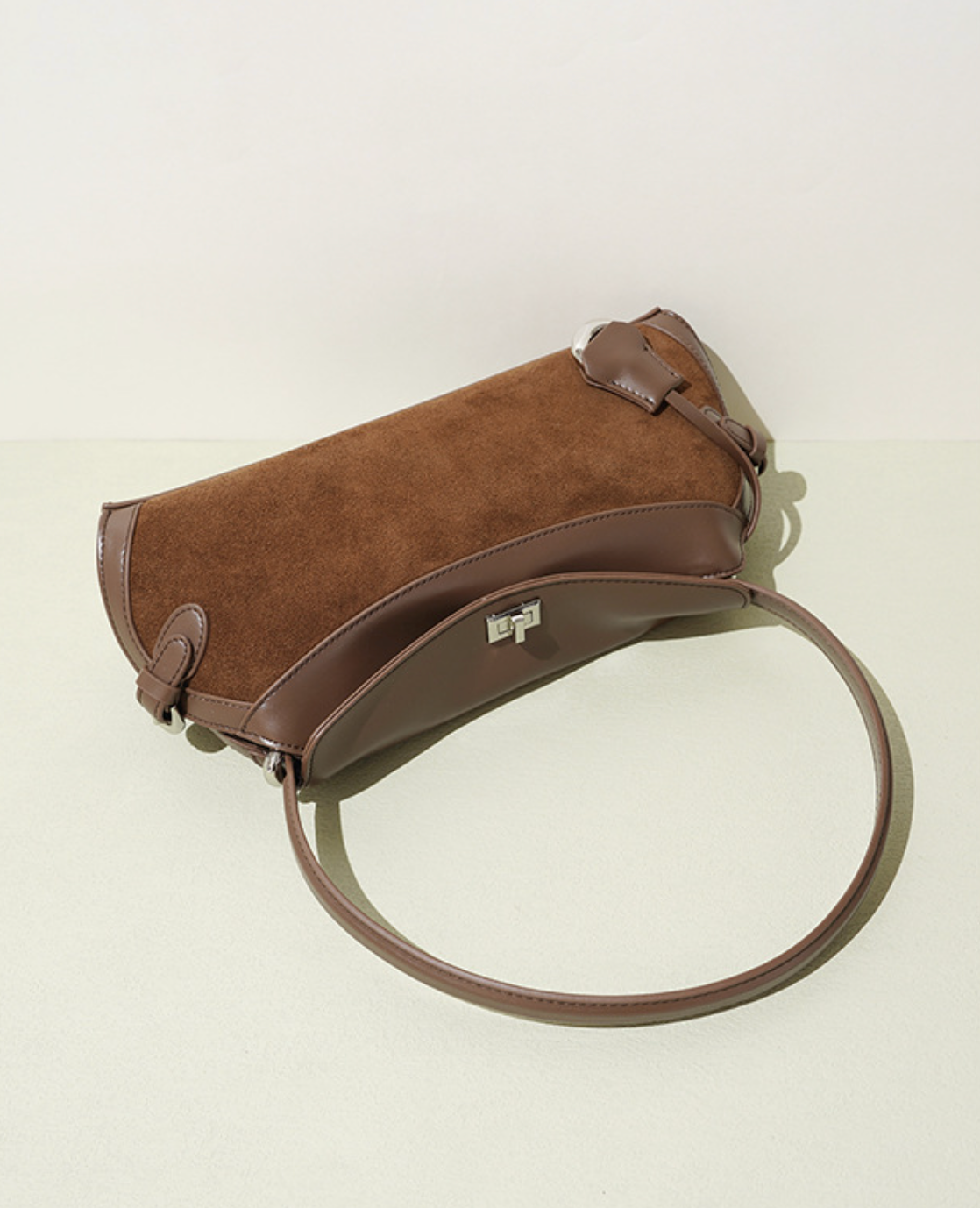 curved suede shoulder bag with flap closure – AURA