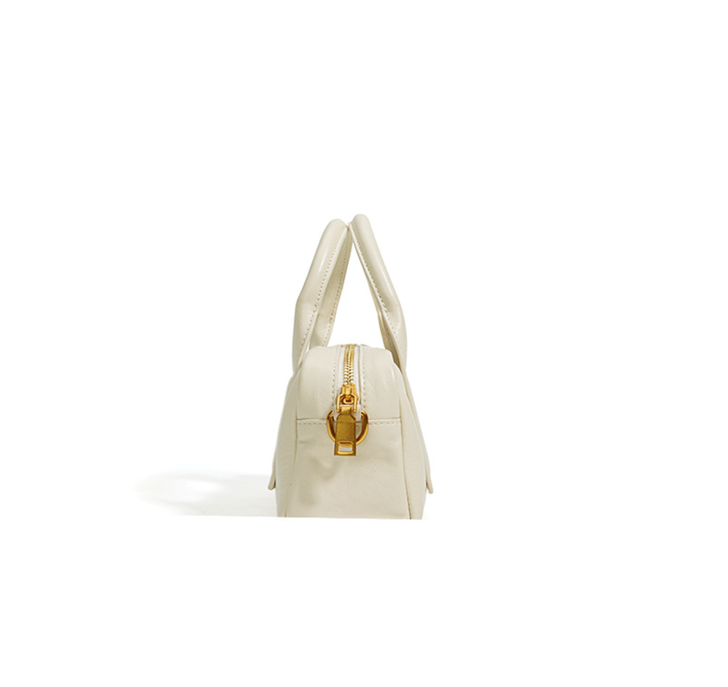 structured mini barrel bag in polished black – VERN