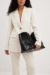 geometric shoulder bag with glossy patchwork finish – ARYXA