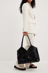 geometric shoulder bag with glossy patchwork finish – ARYXA